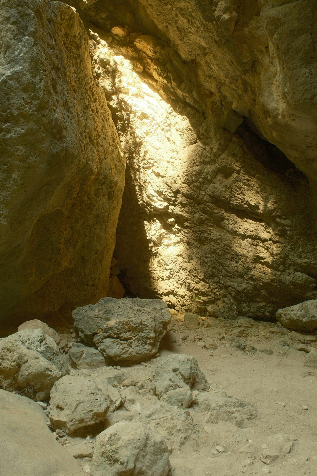 team of explorers inside rocky cave